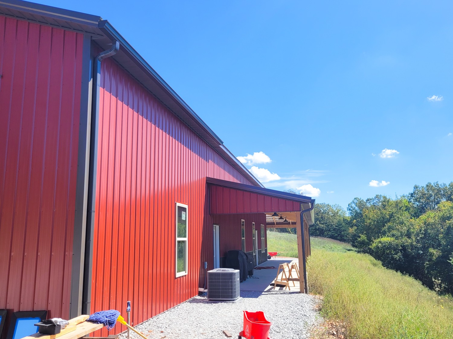 Rustic red metal siding with a burnished slate metal roof ideal structures 2